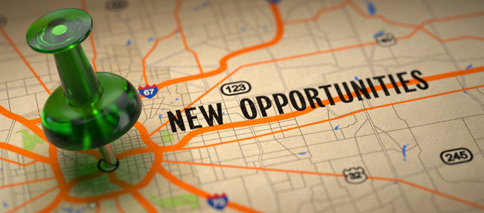 New Opportunities Concept - Green Pushpin on a Map Background with Selective Focus.